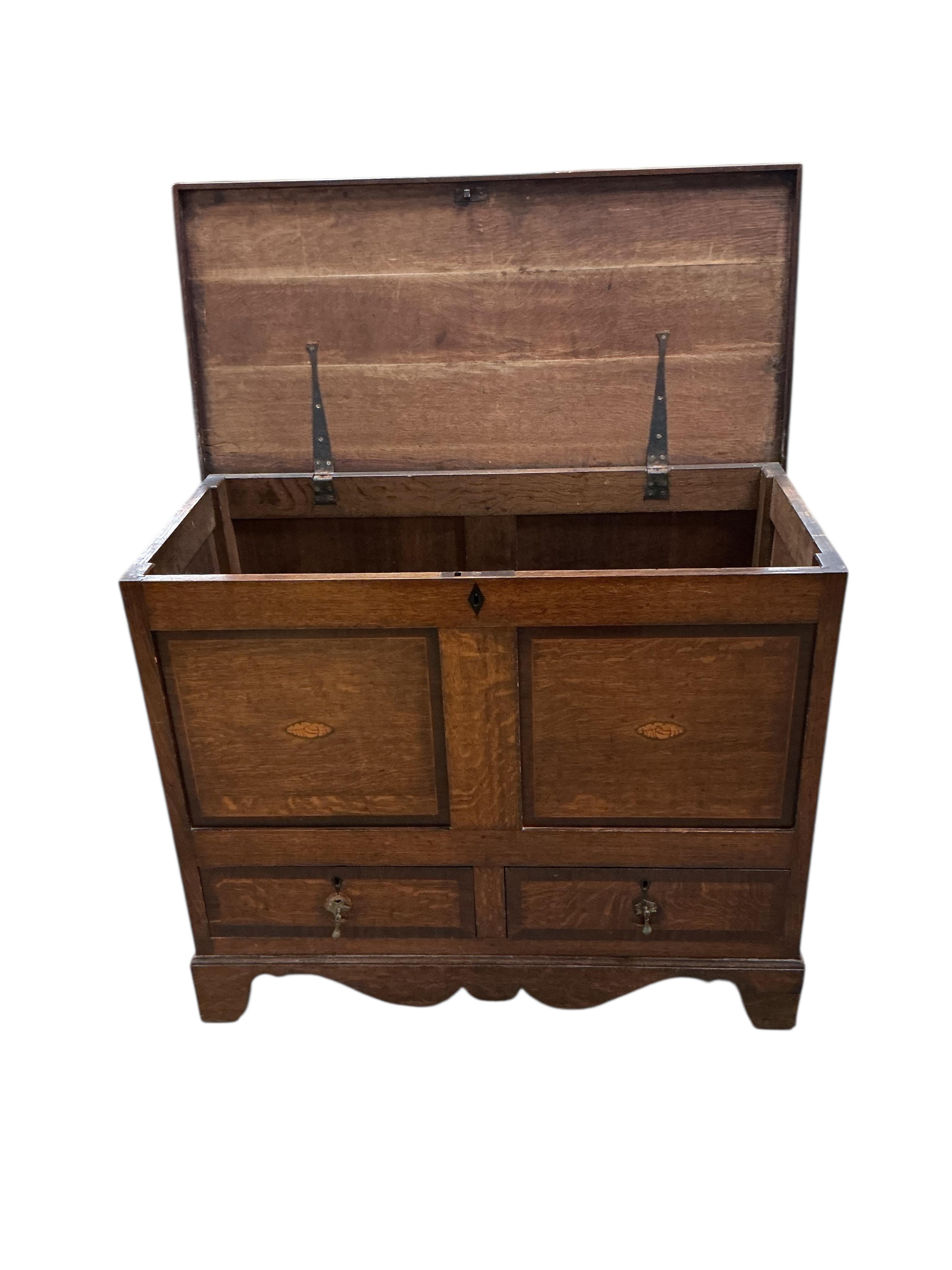 A 19th century inlaid oak mule chest, width 104cm, depth 50cm, height 86cm